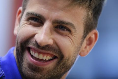 FC Barcelona's Gerard Pique smiles during a press conference at the Sports Center FC Barcelona Joan Gamper in Sant Joan Despi, Spain, Friday, May 26, 2017. FC Barcelona will play against Alaves in the Spanish Copa del Rey soccer final on Saturday. (AP Photo/Manu Fernandez)