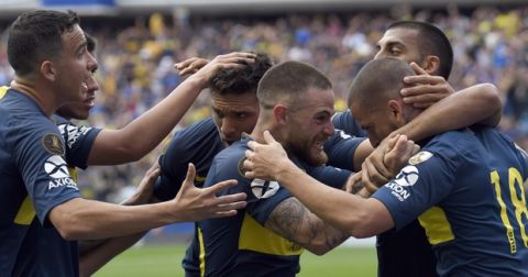 Dario Benedetto of Argentina's Boca Juniors, right, celebrates with his teammates after scoring against Argentina's River Plate during the first leg soccer match of the Copa Libertadores final in Buenos Aires, Argentina, Sunday, Nov. 11, 2018. (AP Photo/Gustavo Garello)