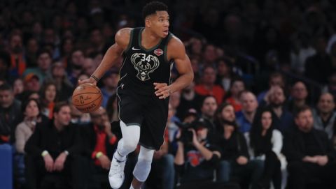 Milwaukee Bucks forward Giannis Antetokounmpo (34) brings the ball up court against the New York Knicks during the third quarter of an NBA basketball game, Saturday, Dec. 1, 2018, in New York.(AP Photo/Julie Jacobson)