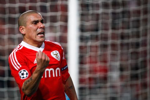 Benfica's Uruguayan defender Maxi Pereira celebrates a goal after scoring against FC Zenit Saint-Petersbourg during a Champions League round of 16 football match at the Luz Stadium in Lisbon on March 6, 2012. AFP PHOTO/ PATRICIA DE MELO MOREIRA (Photo credit should read PATRICIA DE MELO MOREIRA/AFP/Getty Images)