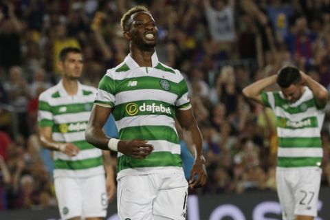 Celtic's Moussa Dembele, center, reacts after missing a penalty kick during a Champions League, Group C soccer match between Barcelona and Celtic, at the Camp Nou stadium in Barcelona, Spain, Tuesday, Sept. 13, 2016. (AP Photo/Emilio Morenatti)