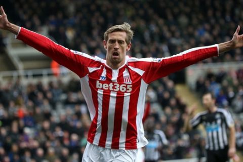 Stoke City's Peter Crouch celebrates his goal during their English Premier League soccer match between Newcastle United and Stoke City at St James' Park, Newcastle, England, Sunday, Feb. 8, 2015. (AP Photo/Scott Heppell)