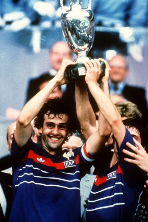 French captain Michel Platini lifts the trophy  