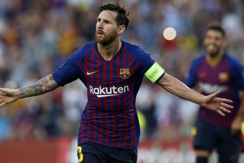Barcelona forward Lionel Messi celebrates after scoring the opening goal of his team during the group B Champions League soccer match between FC Barcelona and PSV Eindhoven at the Camp Nou stadium in Barcelona, Spain, Tuesday, Sept. 18, 2018. (AP Photo/Manu Fernandez)