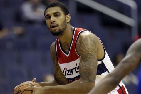 Washington Wizards guard Glen Rice Jr. (14) holds the ball in the second half of a preseason NBA basketball game against the Detroit Pistons Sunday, Oct. 12, 2014 in Washington. The Wizards won 91-89. (AP Photo/Alex Brandon)