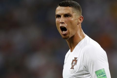 FILE - In this file photo dated Saturday, June 30, 2018, Portugal's Cristiano Ronaldo reacts during the round of 16 match between Uruguay and Portugal during the 2018 soccer World Cup at the Fisht Stadium in Sochi, Russia. Cristiano Ronaldo is leaving Real Madrid it is announced Tuesday July 10, 2018, to join Italian club Juventus, bringing to an end a hugely successful nine-year spell in Spain. (AP Photo/Francisco Seco, FILE)