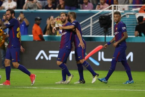 IMAGE DISTRIBUTED FOR INTERNATIONAL CHAMPIONS CUP - FC Barcelona's Ivan Rakitic (#4) celebrates with teammates Leonel Messi (#10) and Neymar (#11) on Saturday, July 29, 2017, in Miami. (Marc Serota/AP Images for International Champions Cup)