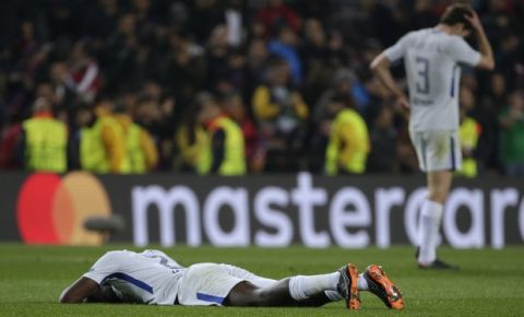 Chelsea's Antonio Ruediger, front, and Chelsea's Marcos Alonso react to their team's elimination during the Champions League round of sixteen second leg soccer match between FC Barcelona and Chelsea at the Camp Nou stadium in Barcelona, Spain, Wednesday, March 14, 2018. (AP Photo/Emilio Morenatti)