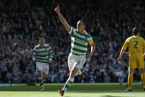 GLASGOW, UNITED KINGDOM - SEPTEMBER 25: Scott Brown of Celtic celebrates his 1-0 goal during the Clydesdale Bank Scottish Premier League match between Celtic and Hibernian at  Celtic Park on September 25, 2010 in Glasgow, Scotland. (Photo by Ian MacNicol/Getty Images)