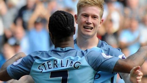 Manchester City's Raheem Sterling, front, celebrates with teammate Kevin De Bruyne after scoring his team's third goal during the English Premier League soccer match between Manchester City and Bournemouth at the Etihad Stadium in Manchester, England, Saturday, Sept. 17, 2016. (AP Photo/Rui Vieira)