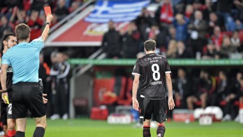 Union's Stephan Fuerstner leaves the pitch after a red card during the German Soccer Cup match between Bayer Leverkusen and Union Berlin in Leverkusen, Germany, Tuesday, Oct. 24, 2017. (AP Photo/Martin Meissner)