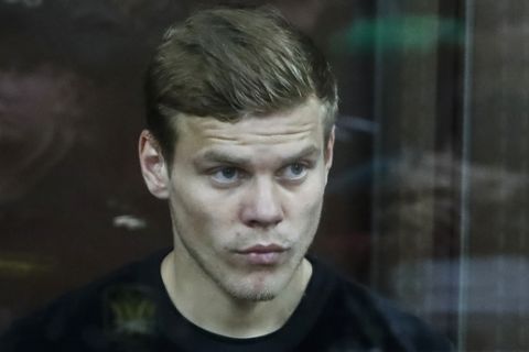 FILE - In this Thursday, Oct. 11, 2018 file photo, Zenit St. Petersburg striker Alexander Kokorin attends hearings in a court in Moscow, Russia. Two Russian soccer internationals have been charged on Thursday, Oct. 18 with battery and hooliganism after both were involved in two brawls in Moscow earlier this month. Alexander Kokorin of Zenit St. Petersburg and Pavel Mamayev of FC Krasnodar were charged following fights at a hotel and at a coffee shop. (AP Photo/Pavel Golovkin, file)