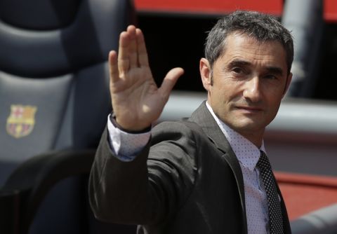 FC Barcelona's new signing coach Ernesto Valverde gestures during his official presentation at the Camp Nou stadium in Barcelona, Spain, Thursday, June 1, 2017. Former player Valverde was hired as the new coach, the club confirmed on Monday.(AP Photo/Manu Fernandez)