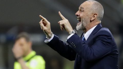 FILE - In this Monday, April 3, 2017 file photo, Inter Milan coach Stefano Pioli gives indications to his players during a Serie A soccer match between Inter Milan and Sampdoria, at the San Siro stadium in Milan, Italy. AC Milan has hired Stefano Pioli as its new coach on a two-year contract. Pioli, who has previously coached the Rossoneris city rival Inter Milan, replaces the fired Marco Giampaolo. (AP Photo/Antonio Calanni, File)