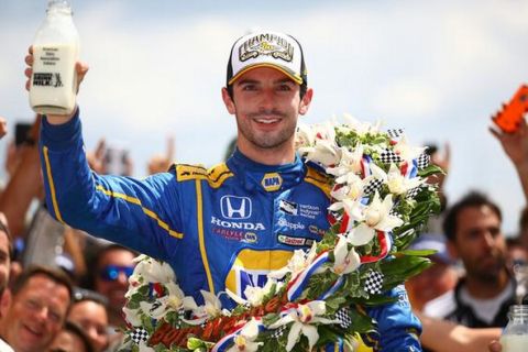 INDIANAPOLIS, IN - MAY 29:  Alexander Rossi, driver of the #98 NAPA Auto Parts Andretti Herta Autosport Honda celebrates after winning the 100th running of the Indianapolis 500 at Indianapolis Motorspeedway on May 29, 2016 in Indianapolis, Indiana.  (Photo by Chris Graythen/Getty Images)