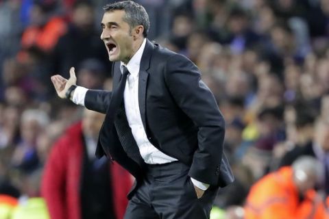 Barcelona's head coach Ernesto Valverde gestures during a Spanish La Liga soccer match between Barcelona and Real Madrid at Camp Nou stadium in Barcelona, Spain, Wednesday, Dec. 18, 2019. Thousands of Catalan separatists are planning to protest around and inside Barcelona's Camp Nou Stadium during Wednesday's "Clasico". (AP Photo/Emilio Morenatti)
