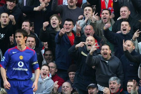Gary Neville of Manchester United gets a warm welcome from Liverpool fans at Anfield