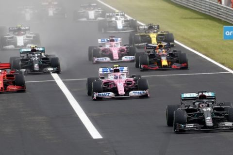 Mercedes driver Lewis Hamilton of Britain leads at the start and followed by Racing Point driver Lance Stroll of Canada during the Hungarian Formula One Grand Prix at the Hungaroring racetrack in Mogyorod, Hungary, Sunday, July 19, 2020. (AP Photo/Darko Bandic)