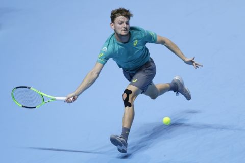 David Goffin of Belgium plays a return to Roger Federer of Switzerland during their ATP World Tour Finals doubles tennis match at the O2 Arena in London, Saturday Nov. 18, 2017. (AP Photo/Tim Ireland)