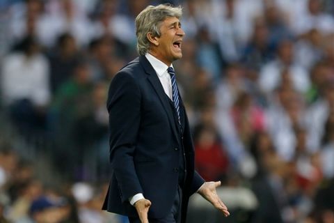 Manchester City manager Manuel Pellegrini gestures during the Champions League semifinal second leg soccer match between Real Madrid and Manchester City at the Santiago Bernabeu stadium in Madrid, Wednesday May 4, 2016. (AP Photo/Francisco Seco)
