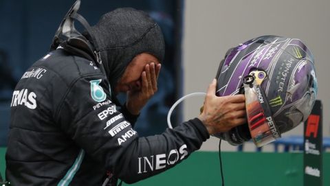 Mercedes driver Lewis Hamilton of Britain reacts after winning the Formula One Turkish Grand Prix at the Istanbul Park circuit racetrack in Istanbul, Sunday, Nov. 15, 2020. (AP Photo/Kenan Asyali, Pool)