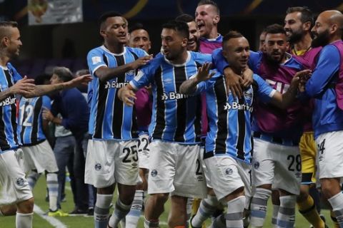 Brazil's Gremio players celebrate the opening goal of their team during the Club World Cup semifinal soccer match between Gremio and Pachuca at the Hazza Bin Zayed stadium in Al Ain, United Arab Emirates, Tuesday, Dec. 12, 2017. (AP Photo/Hassan Ammar)