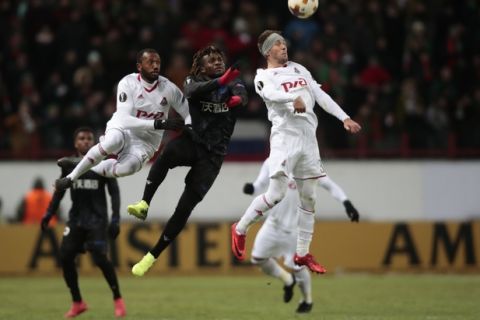 Lokomotiv's Manuel Fernandes, lrft, Nice's Allan Saint-Maximin, center, and Lokomotiv's Maciej Rybus, jump challenging for the ball during the Europa League Round of 32 second leg soccer match between Lokomotiv Moscow and Nice at Lokomotiv stadium in Moscow, Russia, Thursday, Feb. 22, 2018. (AP Photo/Denis Tyrin)