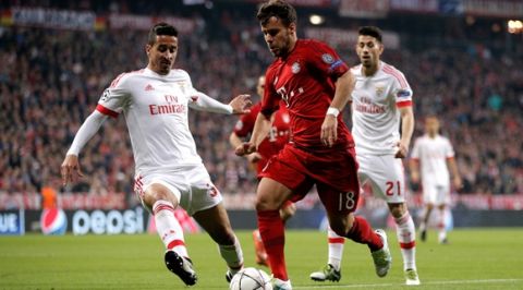 "MUNICH, GERMANY - APRIL 05:  Juan Bernat of Bayern Munich takes on Andre Almeida of Benfica during the UEFA Champions League quarter final first leg match between FC Bayern Muenchen and SL Benfica at Allianz Arena on April 5, 2016 in Munich, Germany.  (Photo by Adam Pretty/Bongarts/Getty Images)"