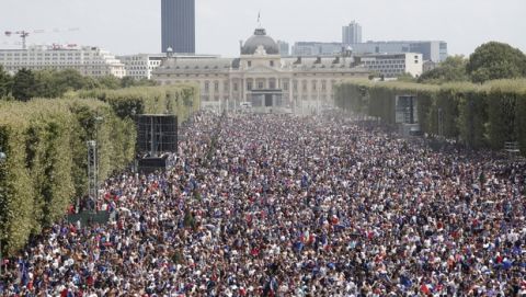 French soccer team supporters gather on the Champ de Mars ahead of the World Cup final between France and Croatia, Sunday, July 15, 2018 in Paris. (AP Photo/Laurent Cipriani)