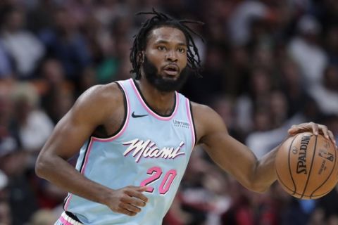 Miami Heat forward Justise Winslow (20) is in action during the second half of an NBA basketball game against the Golden State Warriors, Friday, Nov. 29, 2019, in Miami. The Heat won 122-105. (AP Photo/Lynne Sladky)