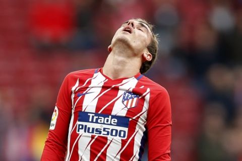 Atletico Madrid's Antoine Griezmann closes his eyes during a Spanish La Liga soccer match between Atletico Madrid and Girona at the Wanda Metropolitano stadium in Madrid, Saturday, Jan. 20, 2018. Griezmann scored once and the match ended in a 1-1 draw. (AP Photo/Francisco Seco)