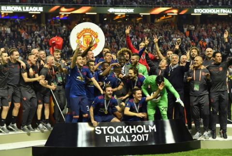 United players celebrate after winning the soccer Europa League final between Ajax Amsterdam and Manchester United at the Friends Arena in Stockholm, Sweden, Wednesday, May 24, 2017. United won 2-0. (AP Photo/Martin Meissner)