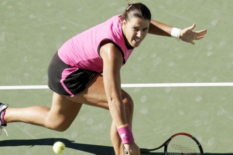 Jennifer Capriati, of the United States, makes a return against Elena Dementieva, of Russia, at the U.S. Open tennis tournament in New York, Friday, Sept. 10, 2004.  (AP Photo/Julie Jacobson)
