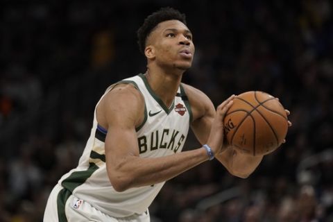 Milwaukee Bucks' Giannis Antetokounmpo shoots during the second half of an NBA basketball game against the Indiana Pacers Wednesday, March 4, 2020, in Milwaukee. The Bucks won 119-100. (AP Photo/Morry Gash)