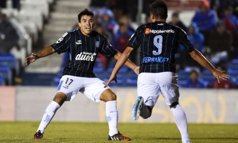Brian Fernandez, right, of Argentina's Racing Club celebrates with teammate Marcos Acuna after scoring against Uruguay's Wanderers during a Copa Libertadores soccer game in Montevideo, Uruguay, Thursday, May 7, 2015. The match ended in a 1-1 draw. (AP Photo/Matilde Campodonico)