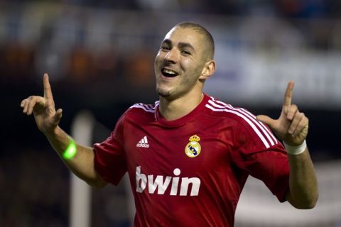 Real Madrid's French forward Karim Benzema celebrates after scoring during the Spanish league football match Valencia CF vs Real Madrid on November 19, 2011 at the Mestalla stadium in Valencia. AFP PHOTO/ Jaime REINA (Photo credit should read JAIME REINA/AFP/Getty Images)