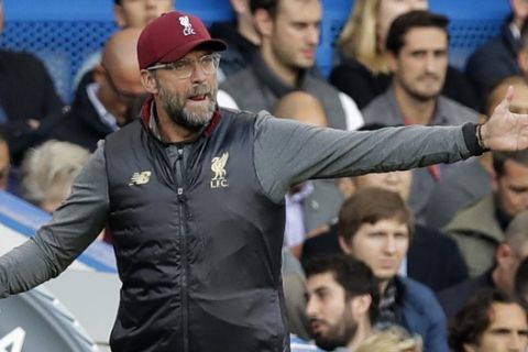 Liverpool's manager Juergen Klopp gives directions to his players during the English Premier League soccer match between Chelsea and Liverpool at Stamford Bridge stadium in London, Saturday, Sept. 29, 2018. (AP Photo/Kirsty Wigglesworth)