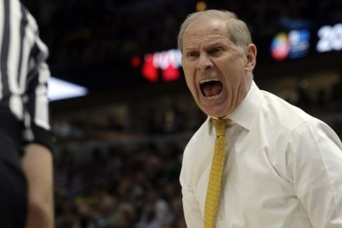 Michigan head coach John Beilein argues a call during the second half of an NCAA college basketball championship game against the Michigan State in the Big Ten Conference tournament, Sunday, March 17, 2019, in Chicago. (AP Photo/Kiichiro Sato)