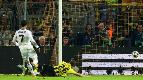 DORTMUND, GERMANY - APRIL 24:  Cristiano Ronaldo of Real Madrid scores their firt goal during the UEFA Champions League semi final first leg match between Borussia Dortmund and Real Madrid at Signal Iduna Park on April 24, 2013 in Dortmund, Germany.  (Photo by Martin Rose/Bongarts/Getty Images)
