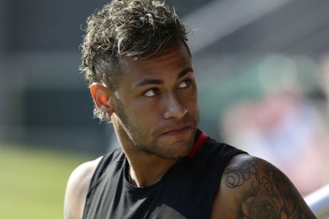 FILE - In this July 17, 2017, file photo, FC Barcelona's Neymar attends a training session in Sant Joan Despi, Spain. Neymar is not for sale, according to Barcelona President Josep Bartomeu. Speaking Thursday, July 20, 2017,  during an interview at The Associated Press, Bartomeu said: "He is not on the market." (AP Photo/Manu Fernandez, File)
