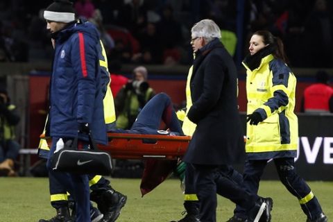PSG's Neymar leaves the pitch on a stretcher after being injured during the French League One soccer match between Paris Saint-Germain and Marseille at the Parc des Princes Stadium, in Paris, France, Sunday, Feb. 25, 2018. (AP Photo/Thibault Camus)
