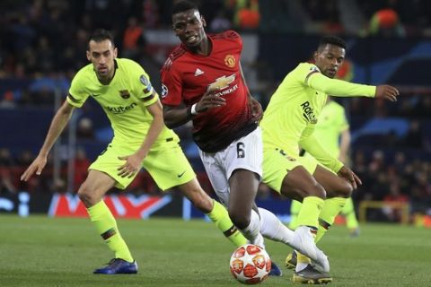 Manchester United's Paul Pogba controls the ball during the Champions League quarterfinal, first leg, soccer match between Manchester United and FC Barcelona at Old Trafford stadium in Manchester, England, Wednesday, April 10, 2019. (AP Photo/Jon Super)