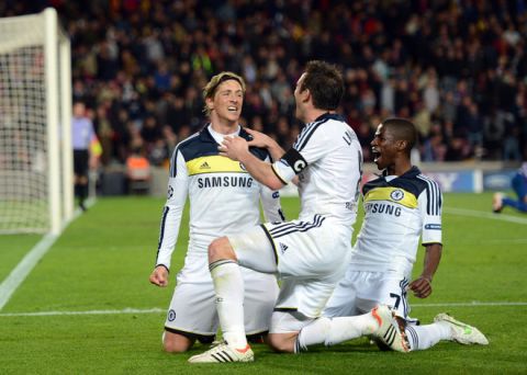 Chelsea's Spanish forward Fernando Torres (L) celebrates with teammates midfielder Frank Lampard (C) and Brazilian midfielder  Ramires (R) after scoring during the UEFA Champions League second leg semi-final football match Barcelona against Chelsea at the Cam Nou stadium in Barcelona on April 24, 2012. Ten-man Chelsea reached the Champions League final after drawing 2-2 with holders Barcelona in their semi-final final second leg clash here to progress 3-2 on aggregate.  AFP PHOTO / ADRIAN DENNIS (Photo credit should read ADRIAN DENNIS/AFP/Getty Images)