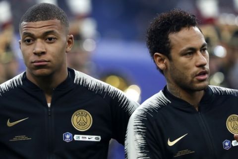 PSG's Kylian Mbappe, left, and PSG's Neymar, right, before the start of the French Cup soccer final between Rennes and Paris Saint Germain at the Stade de France stadium in Saint-Denis, outside Paris, France, Saturday, April 27, 2019. (AP Photo/Thibault Camus)