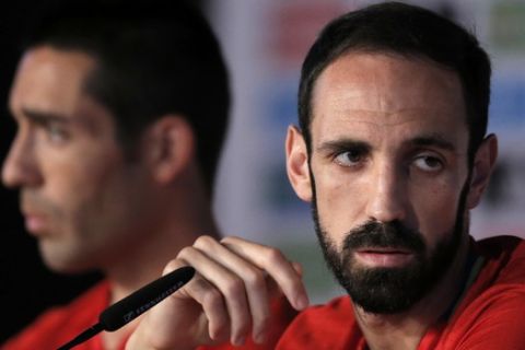 Spain's Juanfran, right, and Bruno Soriano attend a press conference at the Marcel Gaillard  Sports Complex in Saint Martin de Re in France, Thursday, June 23, 2016. Spain will face Italy in a Euro 2016 round of 16 soccer match in Paris on Monday, June 27, 2016. (AP Photo/Manu Fernandez)