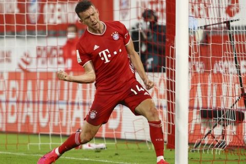 Bayern Munich's Ivan Perisic celebrates scoring their first goal during the German soccer cup semi-final match between Bayern Munich and Eintracht Frankfurt in Munich, Germany, Wednesday, June 10, 2020. (Kai Pfaffenbach/Pool via AP)