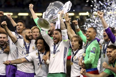 Real Madrid's captain Sergio Ramos raises the trophy after the Champions League Final soccer match between Juventus and Real Madrid at the Millennium Stadium in Cardiff, Wales, Saturday, June 3, 2017. (Nick Potts/PA via AP)