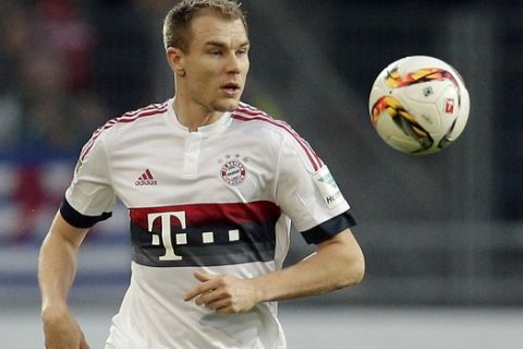 FILE - In this Dec. 19, 2015 file  picture Bayern's Holger Badstuber plays the ball during the German Bundesliga soccer match between Hannover 96 and FC Bayern Munich in Hannover, Germany.  Pep Guardiolas dream of leading Bayern Munich to the treble in his last season in charge for a perfect farewell is in jeopardy due to an injury curse affecting his defenders.  Holger Badstuber is the latest casualty, the Germany center-back fracturing his ankle in an innocuous training ground accident. Badstuber joined Germany defender Jerome Boateng and Spanish international Javi Martinez on the sidelines, leaving Guardiola with a major headache in central defense before the trip to Turin for the Champions League Round of 16 first leg against Italian league leader Juventus.  (AP Photo/Michael Sohn)