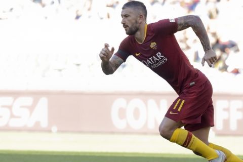 Roma's Aleksandar Kolarov celebrates after scoring his side's second goal during the Serie A soccer match between Roma and Lazio, at the Rome Olympic Stadium, Saturday, Sept. 29, 2018. (AP Photo/Andrew Medichini)
