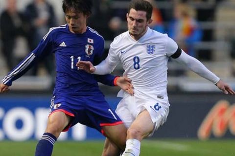 MANCHESTER, ENGLAND - NOVEMBER 15: Lewis Cook of England and Koki Sugimori of Japan compete for the ball during the U19 International friendly match between England and Japan at Manchester City Academy Stadium on November 15, 2015 in Manchester, England. (Photo by Dave Thompson/Getty Images)